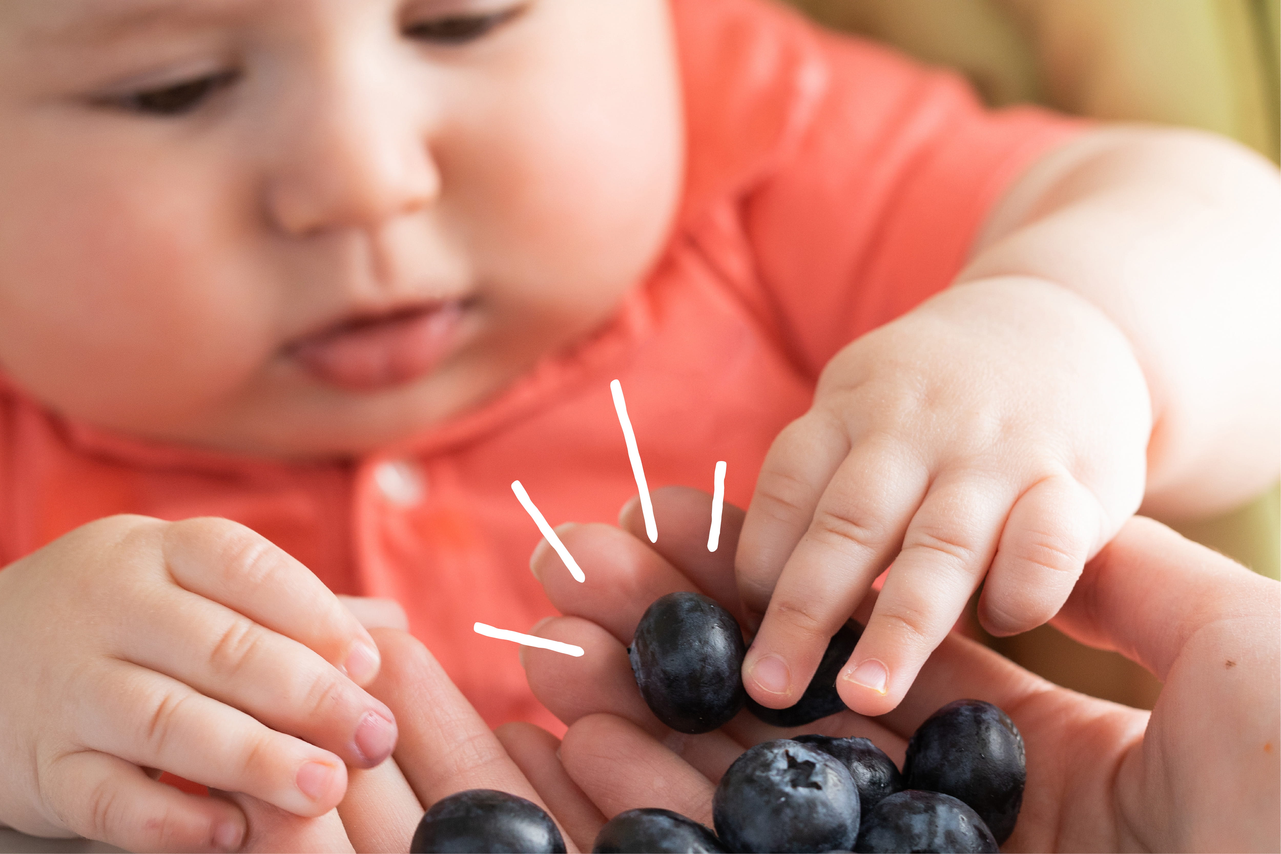 baby with blueberries